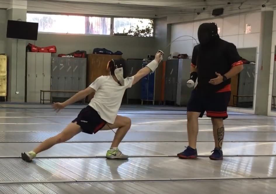 Fencing athletes training together