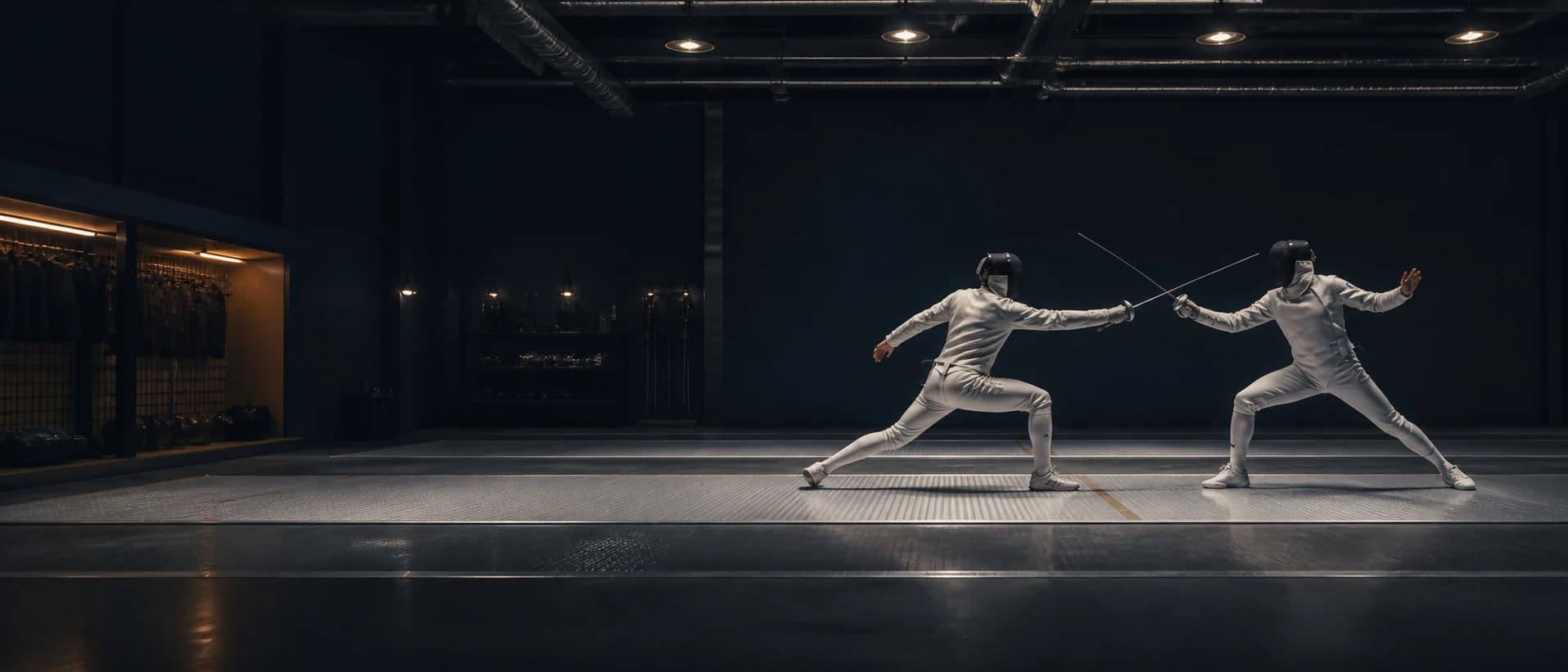 Two fencers training on a dramatic academy piste