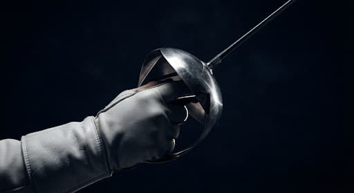 Close-up of a fencing weapon guard and blade